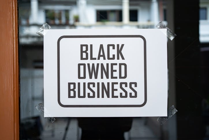 Black owned business sign.
