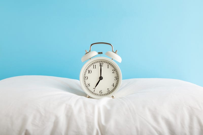 Alarm clock on a pillow. 