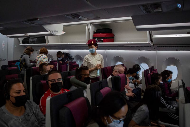 The cabin of a packed Qatar Airways flight from Doha, Qatar to Phuket, Thailand on July 18. 