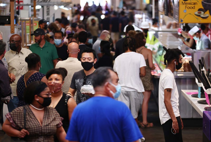 FILE - People wear face coverings in Grand Central Market on July 19, 2021 in Los Angeles.