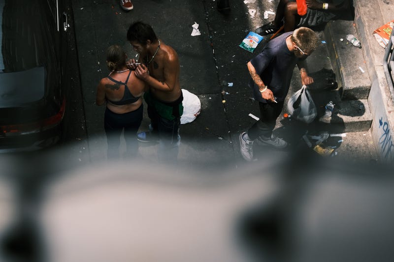 People administer heroin on a street in Kensington on July 19, 2021.