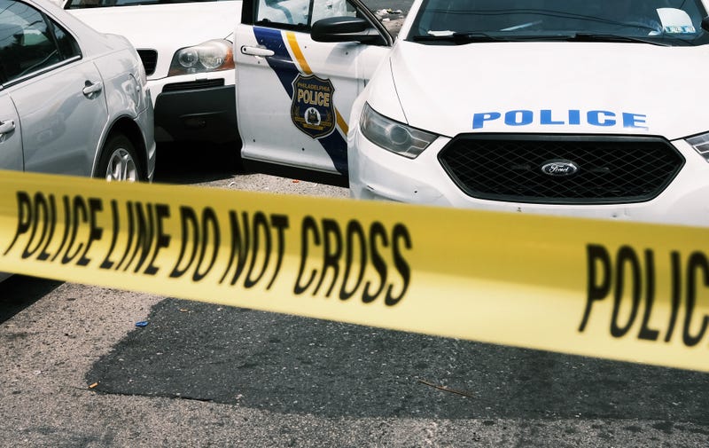 A Philadelphia police car and police tape