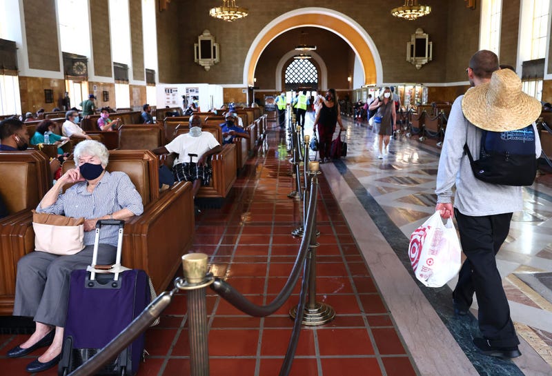 People wear face coverings as they gather in Union Station on July 19, 2021 in Los Angeles, California. A new mask mandate went into effect just before midnight on July 17 in Los Angeles County requiring all people, regardless of vaccination status, to wear a face covering in public indoor spaces amid a troubling rise in COVID-19 cases. 