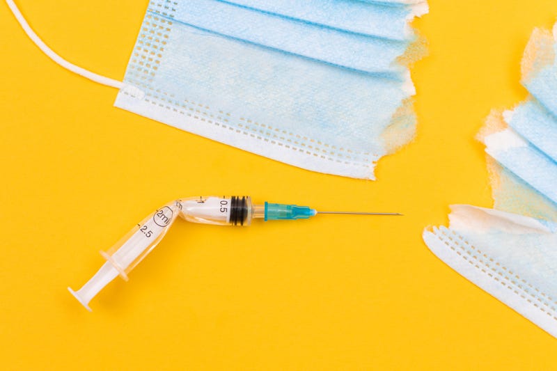 Broken mask and syringe