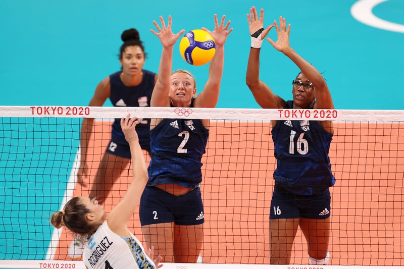 Jordyn Poulter #2 of Team United States and Foluke Akinradewo #16 attempt to block the shot by Elina Maria Rodriguez #1 of Team Argentina during the Women's Preliminary - Pool B on day two of the Tokyo 2020 Olympic Games at Ariake Arena on July 25, 2021 in Tokyo, Japan. 