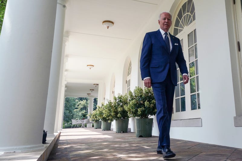 President Joe Biden walks to the White House Rose Garden.