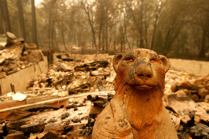 A statue of an animal stands in front of a home that was destroyed by the Dixie Fire on July 26, 2021 in Indian Falls, California.