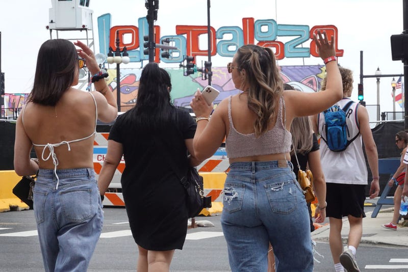 Guests arrive for the first day of the Lollapalooza music festival on July 29, 2021 in Chicago, Illinois. The four-day music festival in the city's downtown is expected to draw 110,000 fans each day.