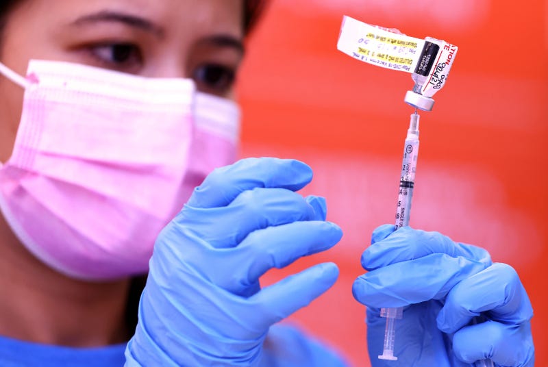 A nurse prepares a dose of the Pfizer COVID-19 vaccine.