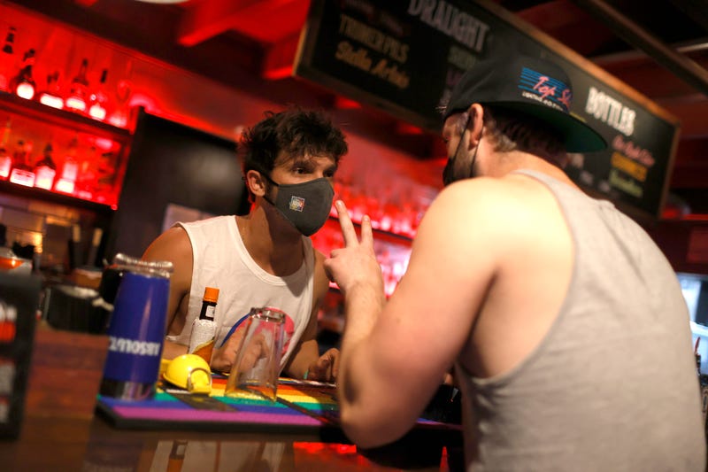 A bartender takes drink orders at Oasis on July 29, 2021 in San Francisco, California.