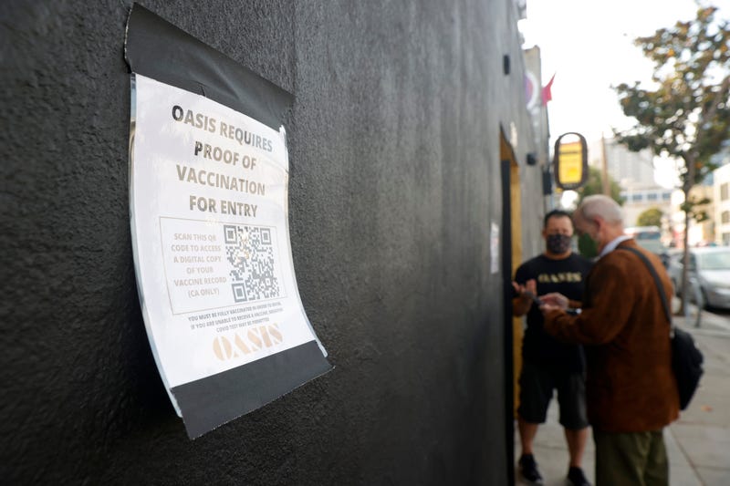 A sign is posted on the front of Oasis announcing that proof of vaccination is required for entry into the club on July 29, 2021 in San Francisco, California.