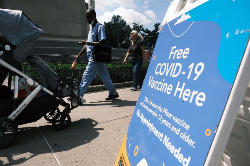 A city-operated mobile pharmacy advertises the COVID-19 vaccine in a Brooklyn neighborhood on July 30, 2021 in New York City. Due to the rapidly spreading Delta variant, New York City Mayor Bill de Blasio has announced that the city will require all city workers to be vaccinated or tested weekly for COVID-19 and the city will now pay any individual $100 to get the shot.
