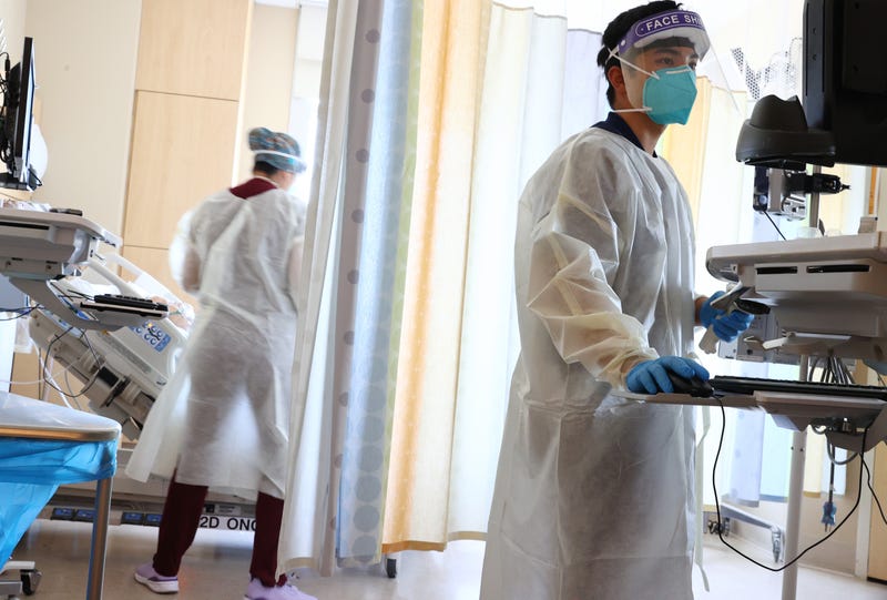 ) Clinicians care for COVID-19 patients in the improvised COVID-19 unit at Providence Holy Cross Medical Center in the Mission Hills neighborhood on July 30, 2021 in Los Angeles, California.