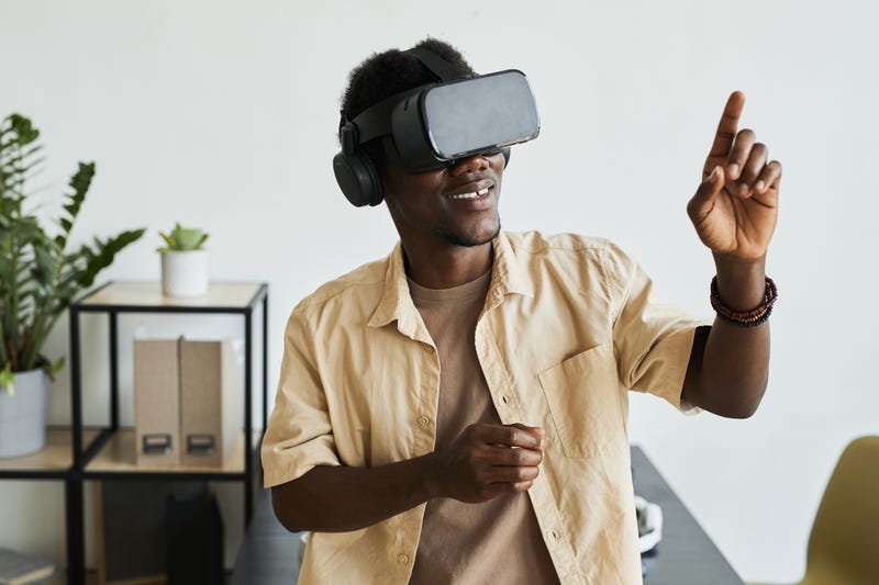Man with VR glasses on stock photo. 