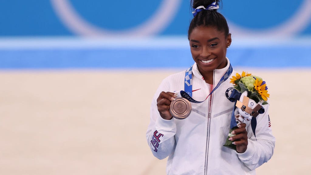 Simone Biles returns from weeklong absence, takes bronze in balance beam event