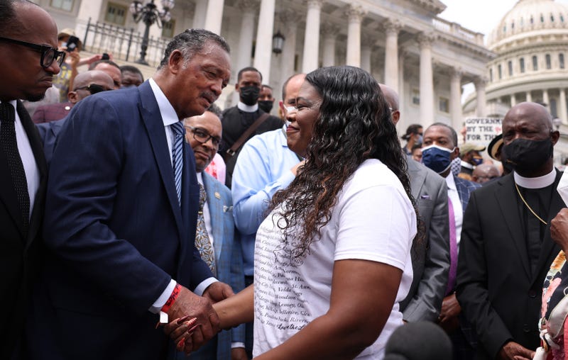 Rep. Cori Bush (D-MO) (R) holds hands with civil rights activist Jesse Jackson, as they rally against the end of the eviction moratorium at the U.S. Capitol on August 03, 2021 in Washington, DC. Bush, and other Representatives, have been sleeping on and occupying the House steps in protest of their House colleagues adjourning for August recess without passing an extension of the eviction moratorium.