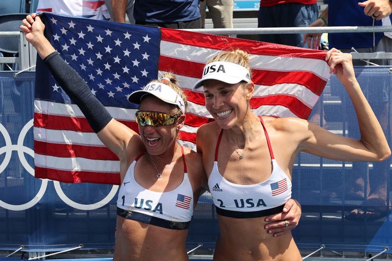 April Ross #1 and Alix Klineman #2 of Team United States celebrate after defeating Team Australia during the Women's Gold Medal Match on day fourteen of the Tokyo 2020 Olympic Games at Shiokaze Park on August 06, 2021 in Tokyo, Japan.