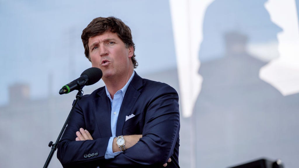 Tucker Carlson tells Washington Post journalist 'go F yourself'