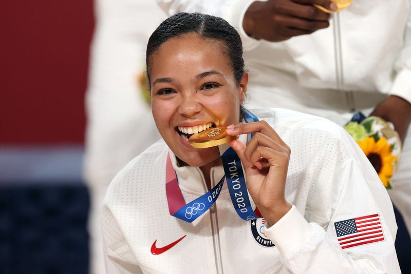 Napheesa Collier #11 of Team United States bites her gold medal during the Women's Basketball medal ceremony on day sixteen of the 2020 Tokyo Olympic games at Saitama Super Arena on August 08, 2021 in Saitama, Japan.