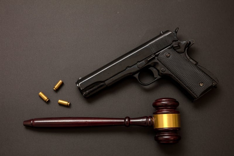 Pistol and gavel stock photo. 