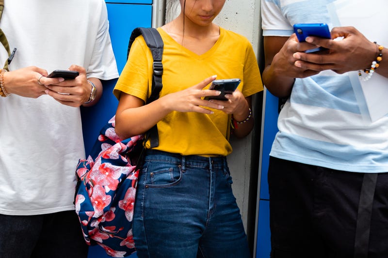 Kids using cell phones in school