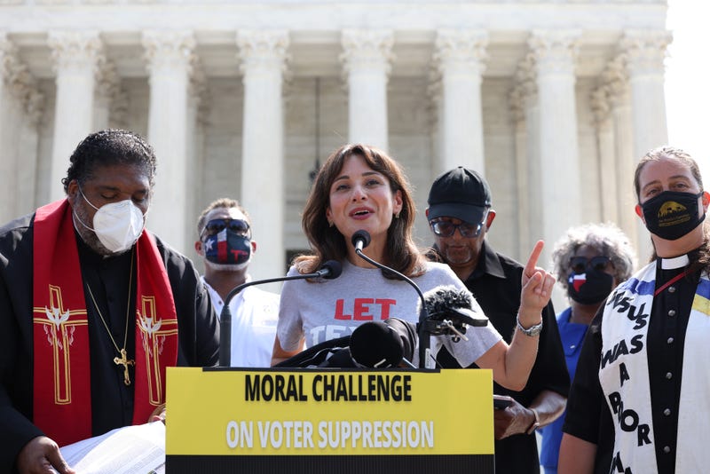 State Rep. Gina Hinojosa speaking in front of the Supreme Court in 2021