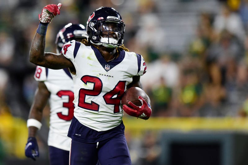 Tremon Smith #24 of the Houston Texans celebrates after a play against the Green Bay Packers in the second half during the preseason game at Lambeau Field on August 14, 2021 in Green Bay, Wisconsin.