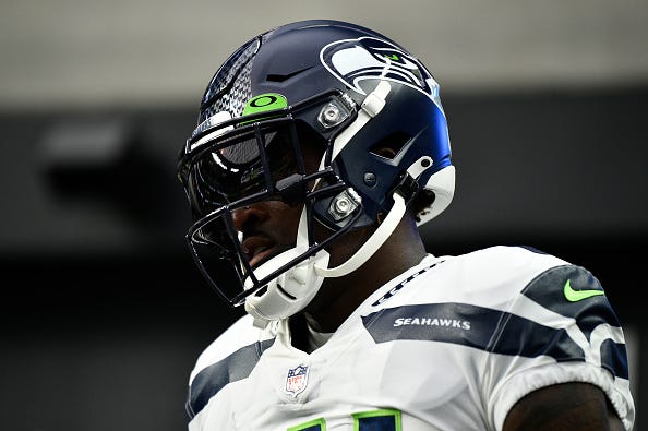 D.K. Metcalf models the Seahawks white uniform tops. 