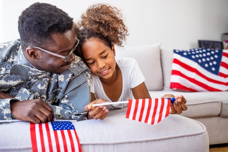 A veteran with his daughter.