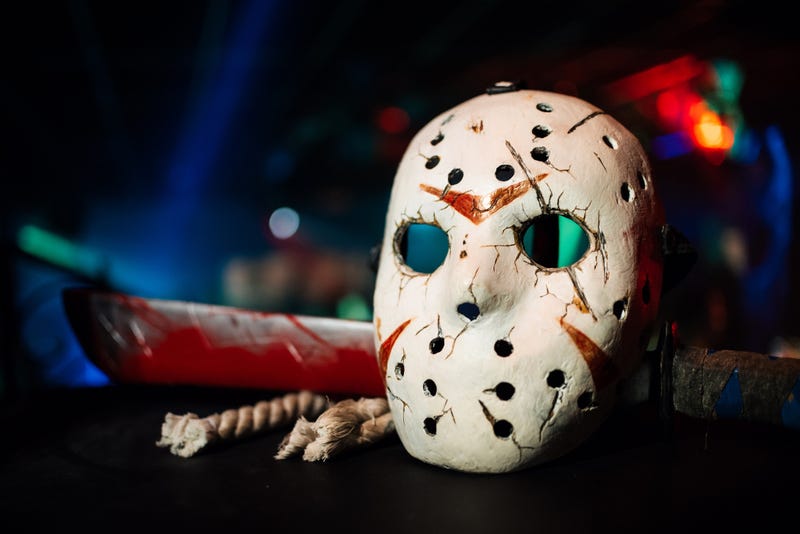 Jack's mask with a bloody sword on Halloween holiday