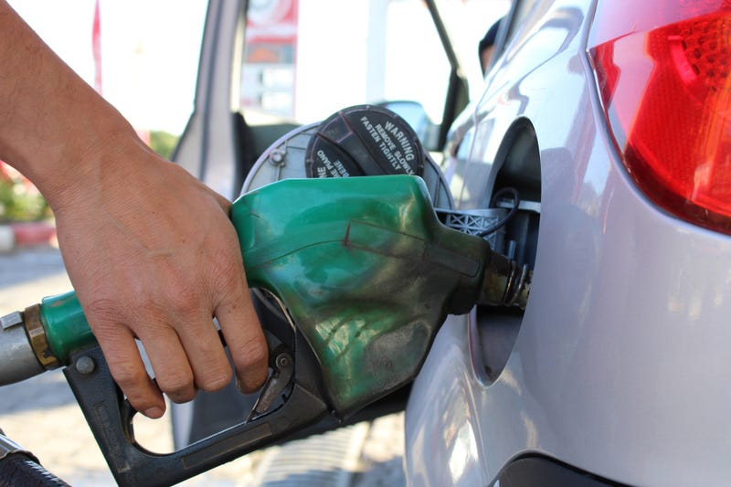 Person getting gas.