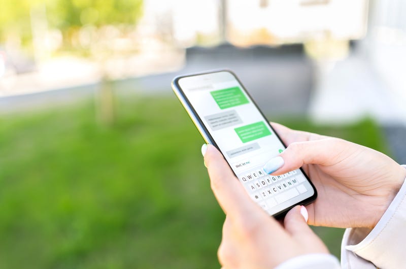 woman texting on phone