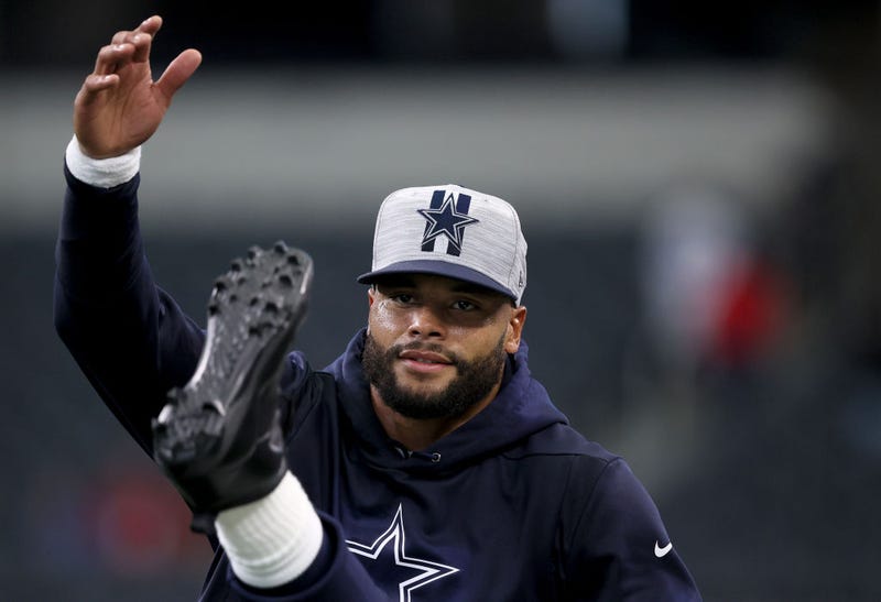 Quarterback Dak Prescott #4 of the Dallas Cowboys moves on the field during pregame warm-ups before the Dallas Cowboys take on the Houston Texans in a preseason NFL game at AT&T Stadium on August 21, 2021 in Arlington, Texas.