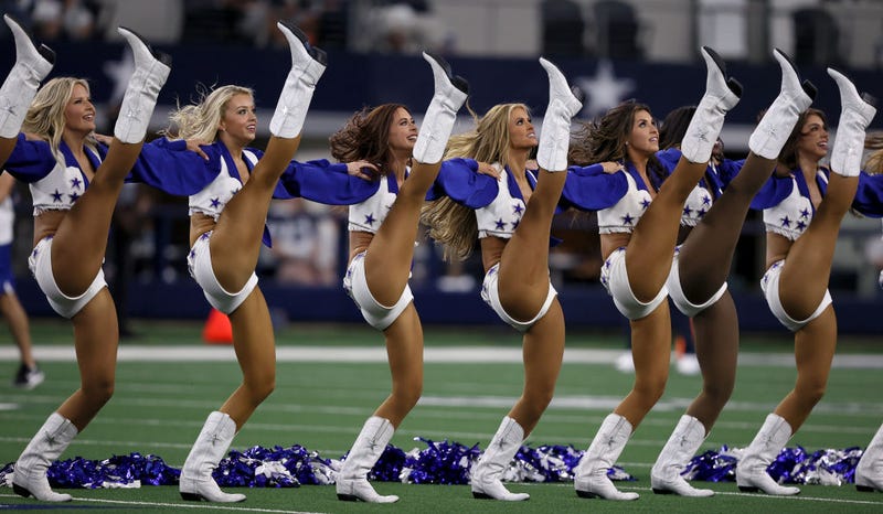 The Dallas Cowboys Cheerleaders perform before the Dallas Cowboys take on the Houston Texans in a preseason NFL game at AT&T Stadium on August 21, 2021 in Arlington, Texas. 
