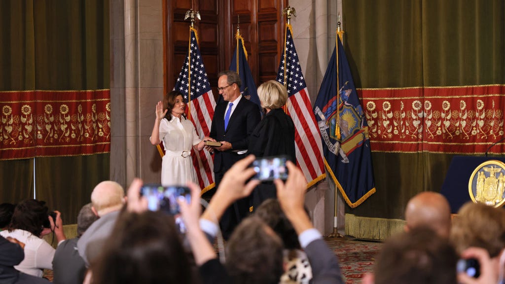 NY's first female governor Kathy Hochul wears suffragette white to swearing-in