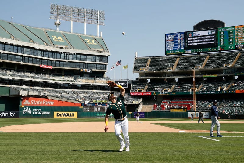 Third baseman Matt Chapman #26 of the Oakland Athletics catches a pop-up in foul territory by Kyle Seager #15 of the Seattle Mariners in the top of the seventh inning at RingCentral Coliseum on August 24, 2021 in Oakland, California.