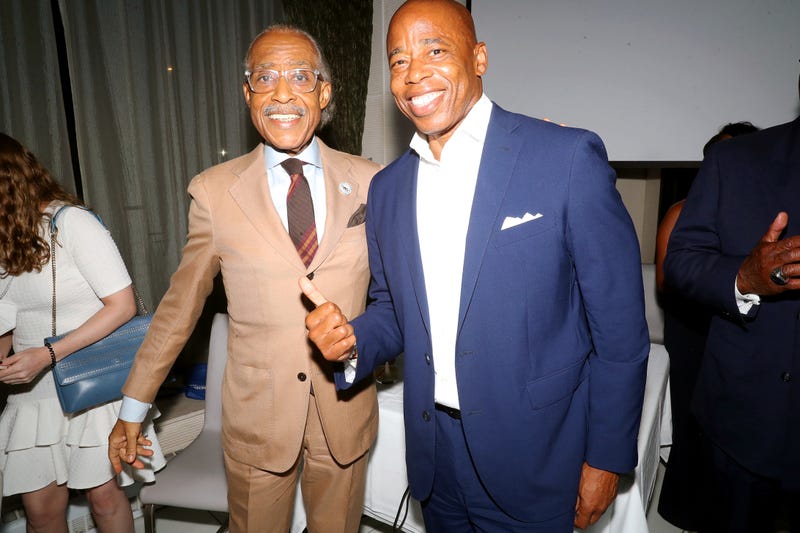 Al Sharpton (L) and Eric Adams celebrate a decade of "PoliticsNation With Al Sharpton" on August 24, 2021 in New York City. 