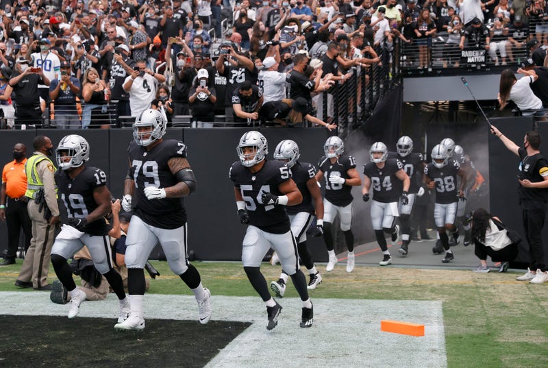 The Las Vegas Raiders take the field against the Seattle Seahawks on August 14th, 2021, at Allegiant Stadium