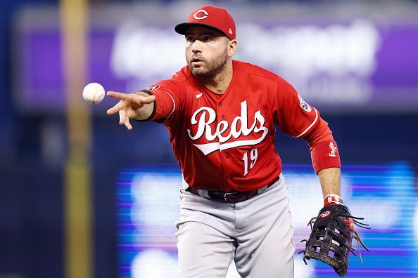 Joey Votto models the Reds alternate red tops.