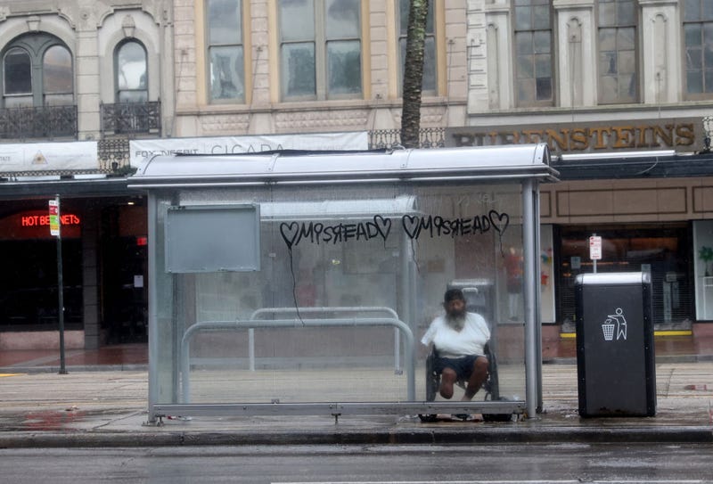 A man seeks protection from wind and rain in a bus shelter during Hurricane Ida on August 29, 2021 in New Orleans, Louisiana. Ida made landfall earlier today southwest of New Orleans. (Photo by Scott Olson/Getty Images)