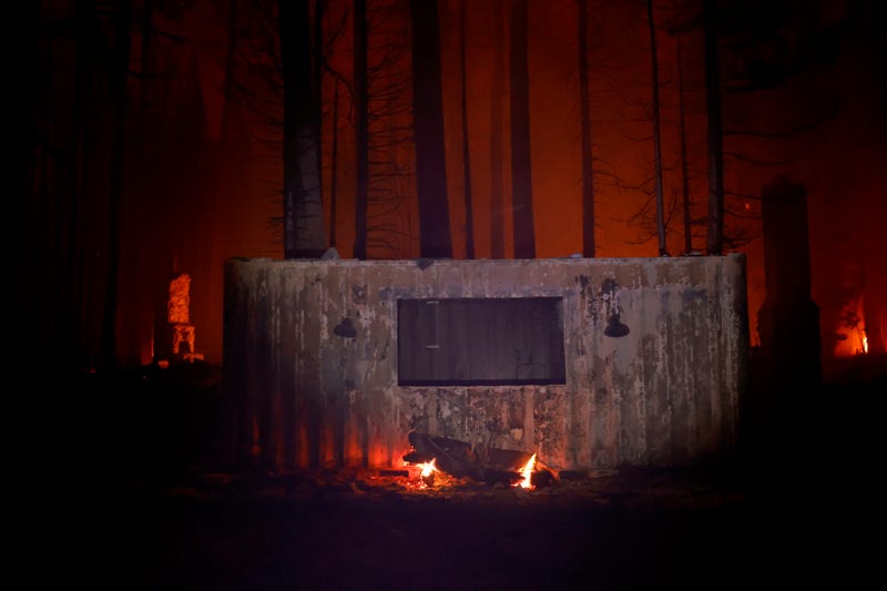 A burnt structure stands near chimneys after the Caldor Fire moved through the area on August 30, 2021 near Twin Bridges, California.
