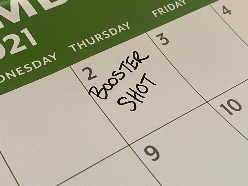 Calendar stock photo with booster shot notice.