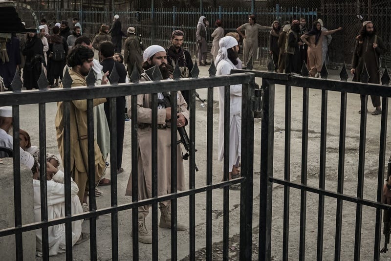 Taliban fighters guard the Afghanistan side of the Torkham crossing.
