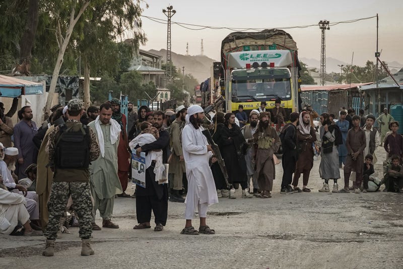 Taliban fighters guard the Afghanistan side of the Torkham crossing on August 20, 2021 as seen from Torkham, Pakistan. (Photo by Danial Shah/Getty Images)