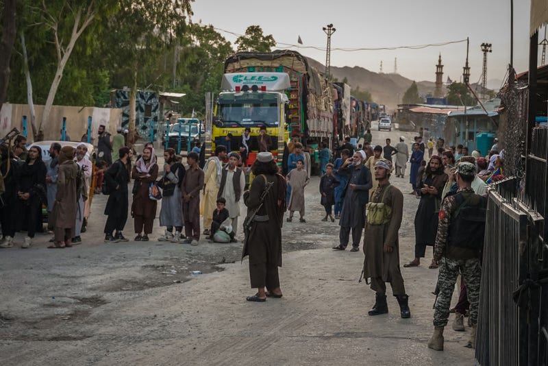 Taliban fighters guard the Afghanistan side of the Torkham crossing on August 20, 2021