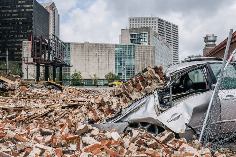 A car is seen under rubble after a building was destroyed by Hurricane Ida on August 30, 2021 in New Orleans, Louisiana. Ida made landfall as a Category 4 hurricane on August 29 in Louisiana and brought flooding and wind damage along the Gulf Coast.