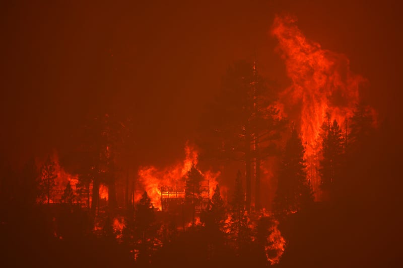 The Caldor Fire burns homes along a ridge on August 30, 2021 near South Lake Tahoe, California.