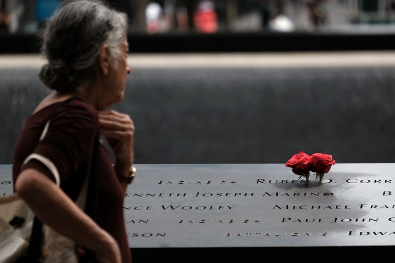 People pay their respects at the September 11 Memorial at Ground Zero on August 31, 2021 in New York City.