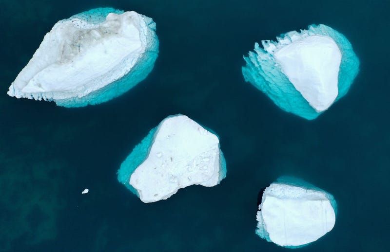  In an aerial view, icebergs which calved from the Sermeq Kujalleq glacier float in the Ilulissat Icefjord on September 04, 2021 in Ilulissat, Greenland. 2021 will mark one of the biggest ice melt years for Greenland in recorded history. Researchers from Denmark estimated that in July of this year enough ice melted on the Greenland Ice Sheet to cover the entire state of Florida with two inches of water. According to NASA, Greenland has melted 5 trillion tons of ice over approximately the past 15 years, enough to increase global sea level by nearly an inch. The observations come on the heels of the recent United Nations report on global warming which stated that accelerating climate change is driving an increase in extreme weather events. (Photo by Mario Tama/Getty Images)