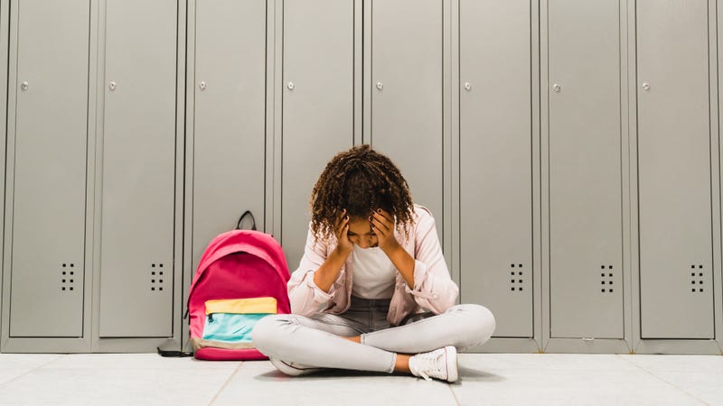 kid at school looking sad